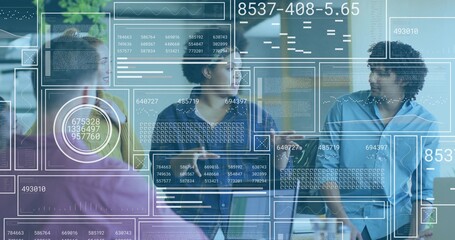 Discussing, five business-casual colleagues standing at glass wall, HUD overlays and tablet visible