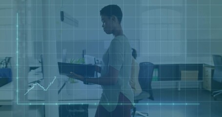 Walking woman holding dark binder in casual attire crossing open-plan office with data overlay