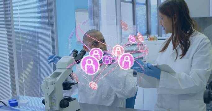 Analyzing 2 researchers working at lab bench with microscope AR overlay in white coats blue gloves