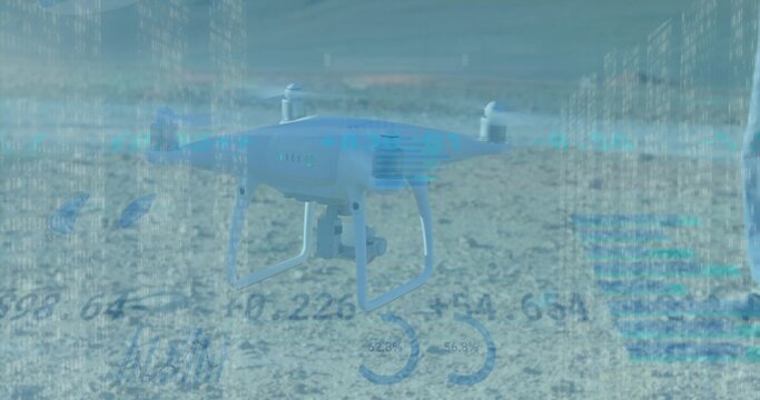 Hovering white quadcopter with camera gimbal showing blue HUD overlays over sandy ground gauge 35 - Powered by Adobe