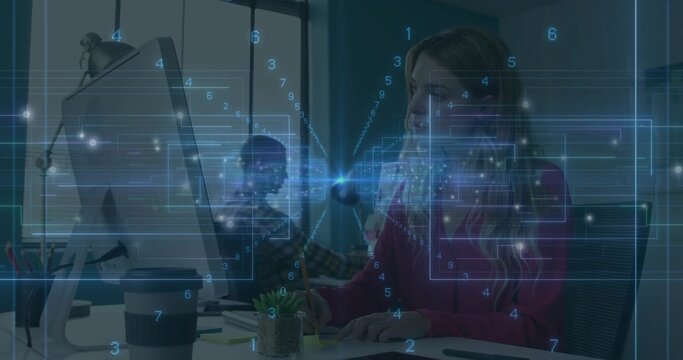 Writing woman in pink blouse checking monitor and scribbling sticky note in office with overlay - Powered by Adobe