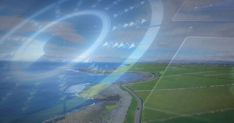 Surveying aerial coast tracing curving road and rocky shoreline by fenced fields with vehicle, HUD