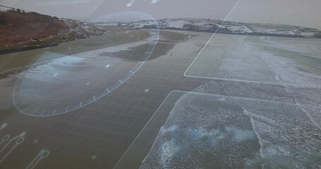 Showing coastal shoreline with HUD overlay from aerial low-tide view, wet flats, waves, headland