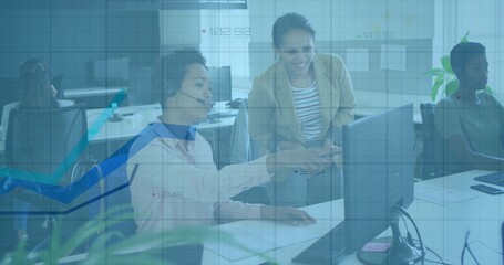 Pointing two women wearing headset and beige blazer, reviewing data grid on monitor in office