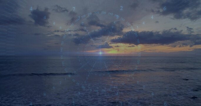 Glowing sun with centered HUD overlay reflecting on ocean at sunset, showing right coastline