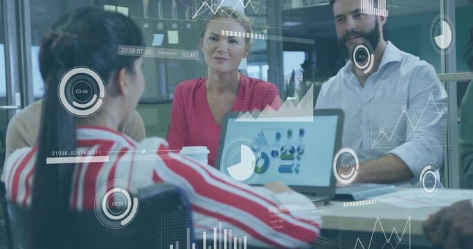 Reviewing team discussing laptop charts at meeting table, red blouse, striped jacket, HUD, coffee - Powered by Adobe