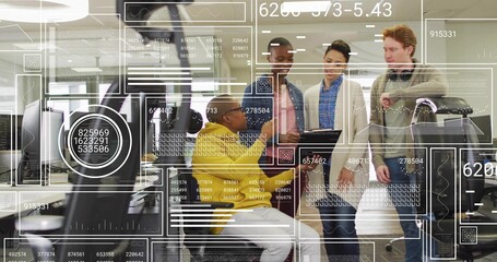 Reviewing coworker in yellow sweater leaning at desk viewing AR overlays laptop tablet suitcase