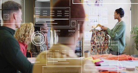 Presenting woman in green cardigan holding patterned dress in studio with AR overlay, copy space