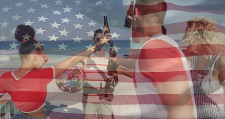 Naklejka premium Toasting five friends raising beer bottles on sandy beach in swimwear with beach ball, flag overlay