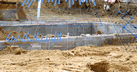 Displaying sandy excavation revealing concrete footings at construction site, AR overlay visible