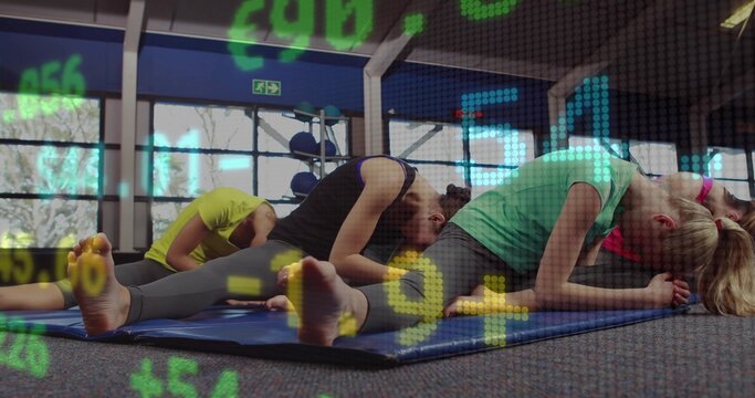 Stretching three women in activewear doing seated forward-folds in gym, blue mats digital overlay