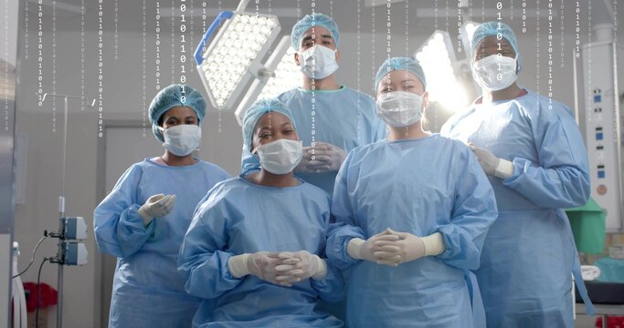 Standing surgical team wearing gowns, caps, masks, gloves, preparing in OR with binary overlay