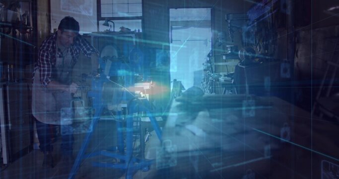 Leaning craftsman operating lathe at workshop, in plaid shirt and apron, with HUD and keyboard - Powered by Adobe