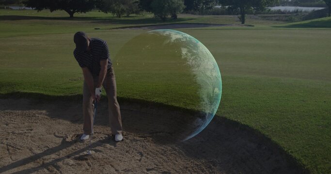 Preparing golfer in golf attire lining up iron shot in bunker with Earth-like hologram, copy space