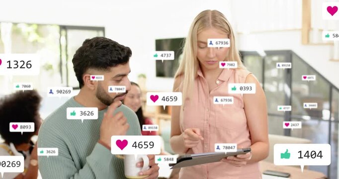 Marketing pair collaborating, woman tapping tablet adding likes while man with mug tracking ROI