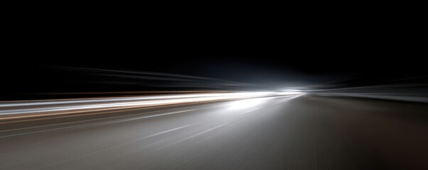 Abstract nighttime long exposure of car lights on the road