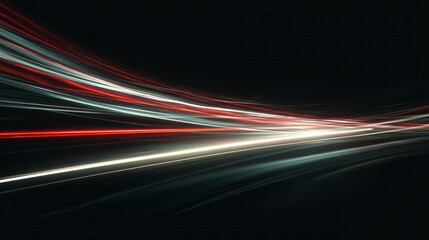 Streaks of red and white light curve across a dark background depicting motion blur