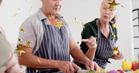 woman gesturing, man slicing cucumber on board while gold stars floating over hands for meal prep