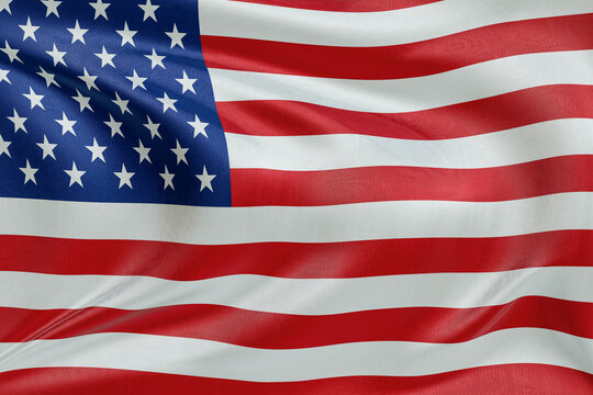 Close-up United States waving flag background with realistic cloth texture. Fabric folds and ripples creating elegant textile motion, functioning as an abstract banner symbol for freedom and identity.