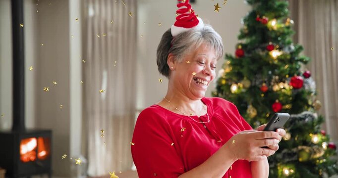 Mature woman reading phone tapping smiling showing star confetti reacting to holiday promo message