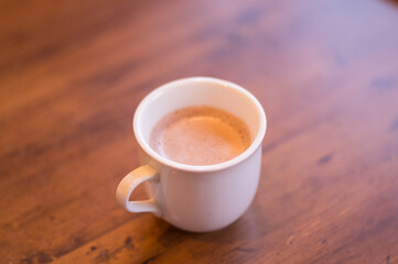 Warm Cup of Hot Cocoa on Wooden Table