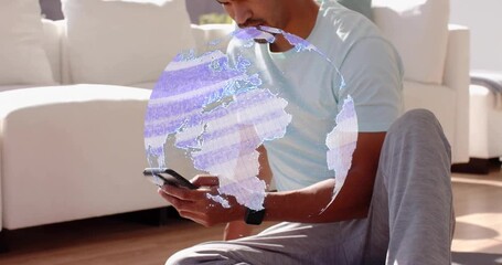 Man tapping smartphone on mat, activating AR globe and viewing tech data for fitness then fading - Powered by Adobe