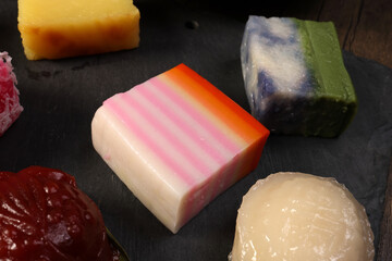 Traditional Malaysian desert Nonyah Kuih making preparing ingredients panadn leaf shredded coconut...