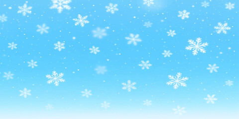 Blue Christmas background with falling snowflakes, a festive winter season design