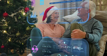 Senior couple sitting on rug discussing finances, starting overlays covering, receding with charts - Powered by Adobe