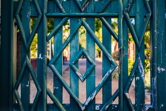 Ornate palace gate with geometric patterns at Estoi Palace in the Algarve