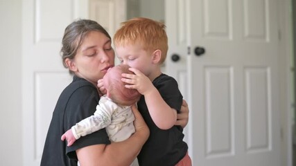 natural scene of maternal care and affection, casual depiction of nurturing and protective family moments, authentic photograph capturing maternal tenderness and loving interaction family
