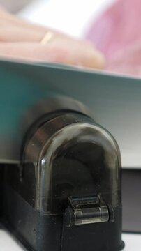 Sharpening kitchen knife. Woman cooking meat. Closeup. Vertical footage