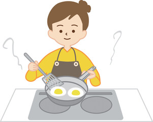 フライパンで料理をする女性