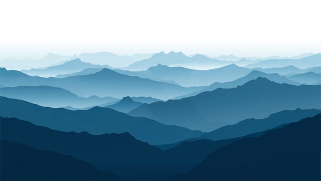 Layered blue mountain ranges fade into a hazy atmospheric distance