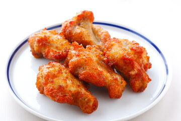 あぶり焼きチキン - 骨付き手羽元を焼き上げた、ジューシーな炙り焼きチキン
