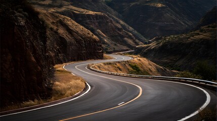 Winding mountain road with sharp curves and dramatic lighting.