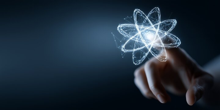 Finger touching digital atom model with glowing core on dark blue background. Concept for science research, nanotechnology advancement and energy innovation - Powered by Adobe