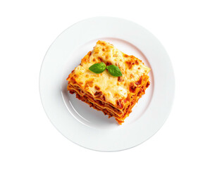 A top-down view of a lasagna serving on a white plate with a basil leaf