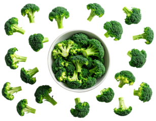 Fresh green broccoli florets scattered around a full bowl on black background