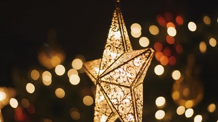 Close-up of a glowing star-shaped Christmas light with bokeh background festive holiday decoration. - Powered by Adobe