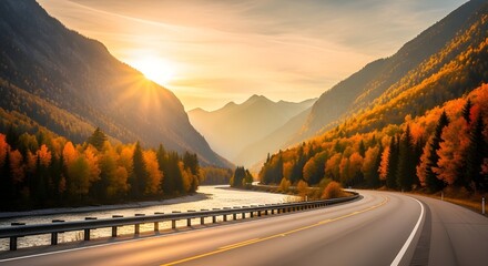 Scenic mountain road during autumn with vibrant foliage and a winding river under a golden sunset sky landscape photography
