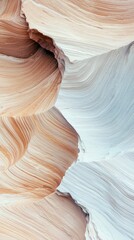 Abstract view of smooth, flowing sandstone formations with distinct layers and textures, illuminated by soft, diffused light, creating a serene and natural abst