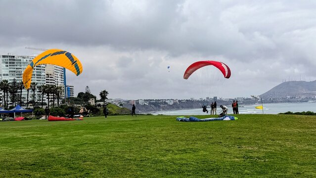 Lima Peru October 17, 2025   Views of the colorful paragliders along the cliffs of the Malecon boardwalk in Lima Peru