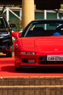 Red Honda NSX front bumper and hood closeup, Classic japanese supercar detail on red carpet