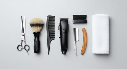 Professional barber tools flat lay. Hairdressing and shaving equipment set on a clean grey background, top view.