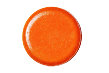 Glossy orange button with faint sparkle isolated on black
