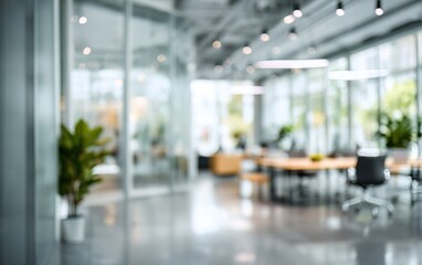 Abstract office interior background. Blurry office space. Modern workspace design. Glass walls, blurred furniture, plants. Natural light, commercial building, business concept, indoor. High quality