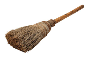 Old, worn broom with a wooden handle on black background