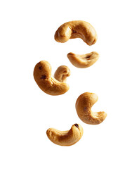 Toasted cashews floating mid-air on a plain backdrop