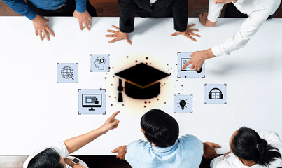 A diverse group of professionals collaborate in a modern office, sharing ideas over educational technology icons, emphasizing teamwork and innovation. Trope